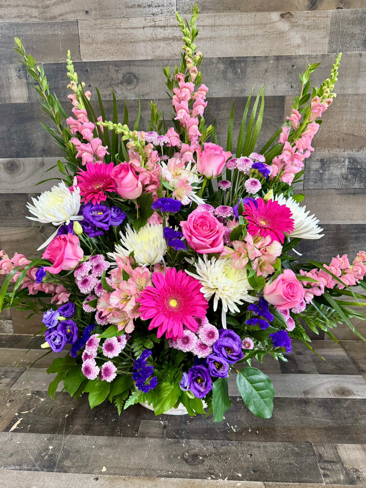 SYMPATHY IN PINKS AND PURPLES DELUXE FUNERAL BASKET – Flowers By Steve, Inc., Haverhill MA