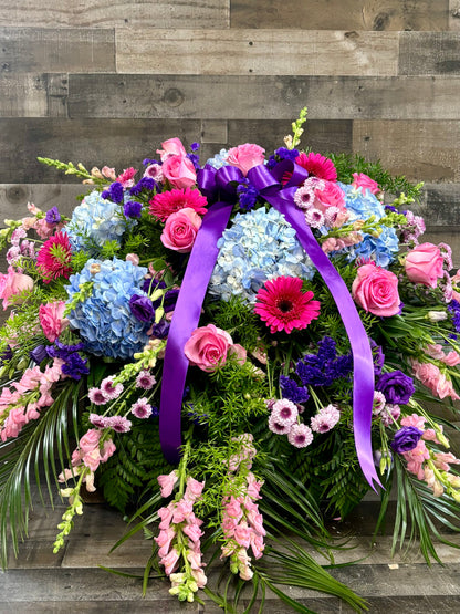 Jewel toned casket spray –  Flowers By Steve, Inc., Haverhill MA